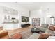 Open concept living area featuring a sectional couch adjacent to the kitchen at 502 Roxanne Nw Ct, Concord, NC 28027