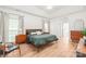 Bright and spacious main bedroom featuring trey ceilings, wood floors, and an ensuite bath at 502 Roxanne Nw Ct, Concord, NC 28027