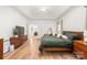 Bright and spacious main bedroom featuring trey ceilings, wood floors, and lots of closet space at 502 Roxanne Nw Ct, Concord, NC 28027