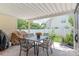 Cozy covered patio with an outdoor dining set and a grill, perfect for entertaining at 502 Roxanne Nw Ct, Concord, NC 28027