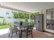 Covered patio has a table and chairs, providing a comfortable outdoor dining space at 502 Roxanne Nw Ct, Concord, NC 28027