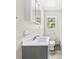Bathroom featuring gray vanity and a window for natural light at 505 Franklin Ave, Shelby, NC 28150
