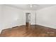 Bedroom featuring hardwood floors, neutral walls, and an open doorway at 505 Franklin Ave, Shelby, NC 28150