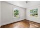 Bright bedroom with hardwood floors and windows with outdoor views at 505 Franklin Ave, Shelby, NC 28150