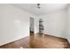 Open dining room featuring hardwood floors and access to other rooms at 505 Franklin Ave, Shelby, NC 28150