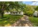 Charming home featuring a lush green lawn and a driveway leading up to the residence at 505 Franklin Ave, Shelby, NC 28150