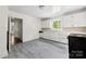 Bright kitchen features white cabinets, window over sink, and vinyl flooring at 505 Franklin Ave, Shelby, NC 28150