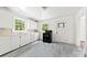 Functional kitchen with white cabinets, countertops, and modern appliances at 505 Franklin Ave, Shelby, NC 28150
