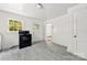View of the kitchen showcasing a black stove and vinyl flooring at 505 Franklin Ave, Shelby, NC 28150