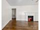Bright living room featuring a fireplace and gleaming hardwood floors at 505 Franklin Ave, Shelby, NC 28150