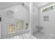 Well-lit bathroom featuring sleek subway tile and black and white floors at 506 Clement Ave, Charlotte, NC 28204