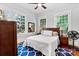 Comfortable bedroom with ample natural light, ceiling fan, and hardwood floors at 506 Clement Ave, Charlotte, NC 28204