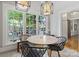 Breakfast nook featuring a round table, stylish chairs, and large windows overlooking the backyard at 506 Clement Ave, Charlotte, NC 28204