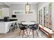 Bright breakfast nook with a round table, modern chairs, and a large window with a view at 506 Clement Ave, Charlotte, NC 28204