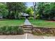 Well-maintained front yard and stone walkway lead to this charming home with a covered front porch at 506 Clement Ave, Charlotte, NC 28204
