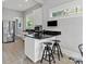 This kitchen has granite countertops, stainless steel appliances and a breakfast bar with stool seating at 506 Clement Ave, Charlotte, NC 28204
