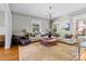 Bright living room featuring neutral walls, hardwood floors, and large windows at 506 Clement Ave, Charlotte, NC 28204