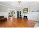Bright living room featuring hardwood floors, fireplace and open floor plan at 506 Clement Ave, Charlotte, NC 28204