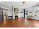 Bright living room featuring hardwood floors, fireplace and natural light from windows at 506 Clement Ave, Charlotte, NC 28204