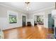 Bright living room with hardwood floors and large windows offering an open floor plan at 506 Clement Ave, Charlotte, NC 28204