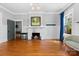 Charming living room featuring a fireplace, hardwood floors, and natural light from windows at 506 Clement Ave, Charlotte, NC 28204