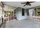 Spacious screened porch with ceiling fan offering an indoor-outdoor living experience at 506 Clement Ave, Charlotte, NC 28204