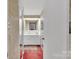 Bright bathroom featuring white cabinets, vintage fixtures, and mirrored closet doors at 514 Wood St, Troy, NC 27371