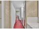 Hallway features unique carpet, tiled walls, and mirrored closet doors at 514 Wood St, Troy, NC 27371