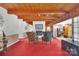 Inviting living room with white brick fireplace, wood beams, and seamlessly connected layout at 514 Wood St, Troy, NC 27371