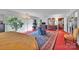 Bright main bedroom featuring large windows, a cozy sitting area, and vintage accents at 514 Wood St, Troy, NC 27371