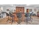 Well-stocked wet bar area features barstool seating, ample storage, and brick surround, perfect for hosting gatherings at 514 Wood St, Troy, NC 27371