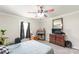 Cozy bedroom featuring neutral decor, a window, and a ceiling fan at 515 Myrtle Ave, Chester, SC 29706