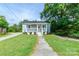 Charming home with covered porch, landscaped front yard, and walkway to the front door at 515 Myrtle Ave, Chester, SC 29706