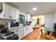 Updated kitchen with white cabinets and stainless steel appliances at 515 Myrtle Ave, Chester, SC 29706