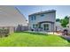 Outdoor backyard with a patio, dining table, grill and manicured lawn at 5228 Tomsie Efird Ln, Charlotte, NC 28269