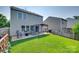 This backyard features a patio area with seating and a grassy lawn at 5228 Tomsie Efird Ln, Charlotte, NC 28269