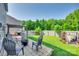 Spacious backyard offers a patio seating area and fenced lawn for relaxing or entertaining at 5228 Tomsie Efird Ln, Charlotte, NC 28269