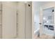 Bright bathroom featuring a shower and tub combination, plus an open doorway into a bedroom at 5228 Tomsie Efird Ln, Charlotte, NC 28269
