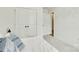 White bedroom with closet and doorway; neutral color palette and decorative hexagon wall art at 5228 Tomsie Efird Ln, Charlotte, NC 28269