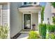 Charming front entry of home with manicured landscaping and welcoming door at 5228 Tomsie Efird Ln, Charlotte, NC 28269