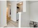 Upstairs hallway with access to a closet and a peek at the staircase and decor at 5228 Tomsie Efird Ln, Charlotte, NC 28269