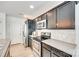 Modern kitchen featuring stainless steel appliances, granite countertops, and dark wood cabinetry at 5228 Tomsie Efird Ln, Charlotte, NC 28269