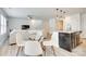 Open-concept living room and dining area with modern decor and lots of natural light at 5228 Tomsie Efird Ln, Charlotte, NC 28269
