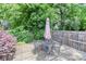 Back deck with a table, chairs, umbrella, and a privacy fence at 536 Carroll St, Statesville, NC 28625