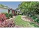 Lush backyard featuring brick walkway, healthy grass, and well-manicured landscaping at 536 Carroll St, Statesville, NC 28625
