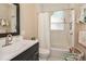 Charming bathroom with black and white tiled floors, a shower/tub with white subway tile, and stylish fixtures at 536 Carroll St, Statesville, NC 28625