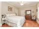 Cozy bedroom with hardwood floors, neutral paint, and a dresser with mirror at 536 Carroll St, Statesville, NC 28625