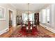 Formal dining room with a large table, chandelier, and built in cabinets at 536 Carroll St, Statesville, NC 28625