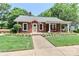 Charming brick home with covered porch, manicured lawn, and inviting curb appeal at 536 Carroll St, Statesville, NC 28625
