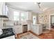 Bright kitchen with stainless steel appliances, hardwood floors, and an island at 536 Carroll St, Statesville, NC 28625